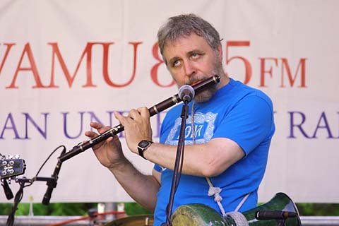 Bernard playing flute.